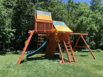 shaded Woodplay playground or playsets with climbing rock wall and slides - Indianapolis swingsets